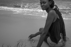 A young woman met on the beach at Point Noir